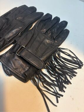 Women’s black leather motorcycle gloves fringe detailing adjustable closure